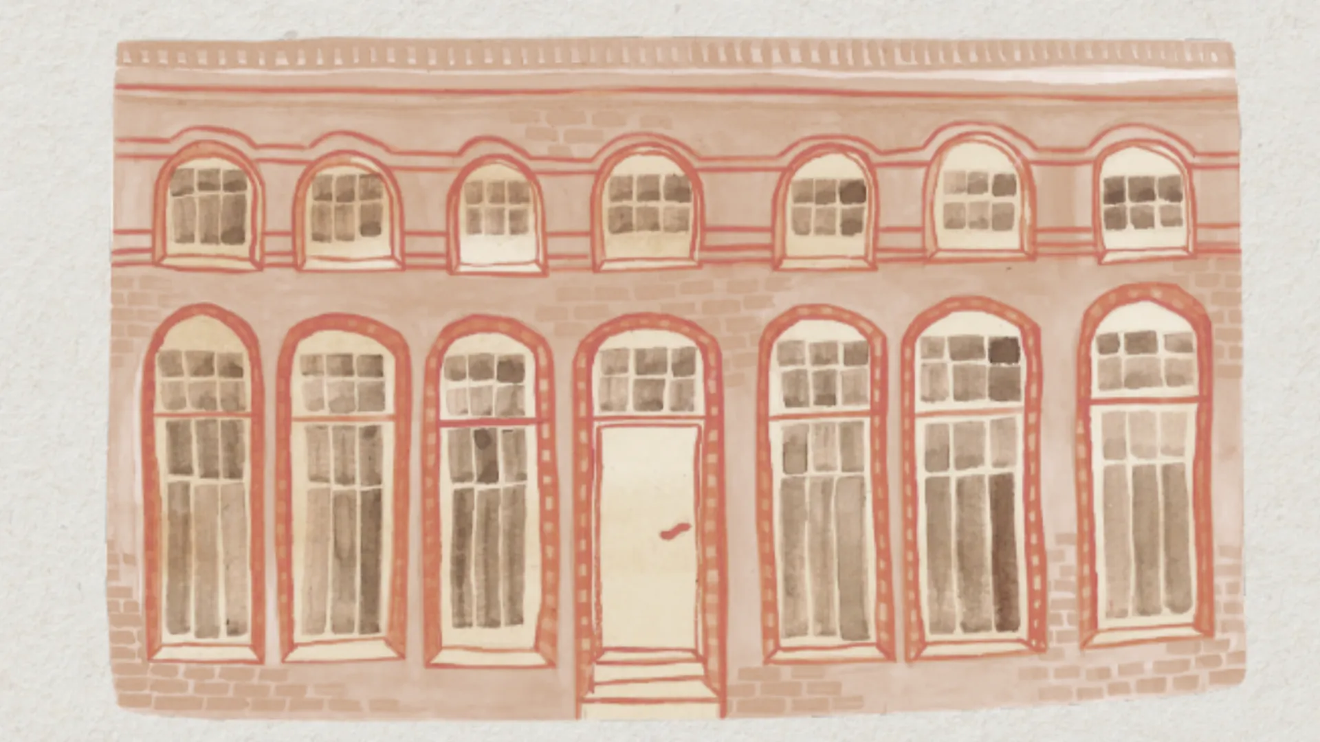 Backsteinfassade des Boutiquehotels Petuh mit roten Sprossenfenstern